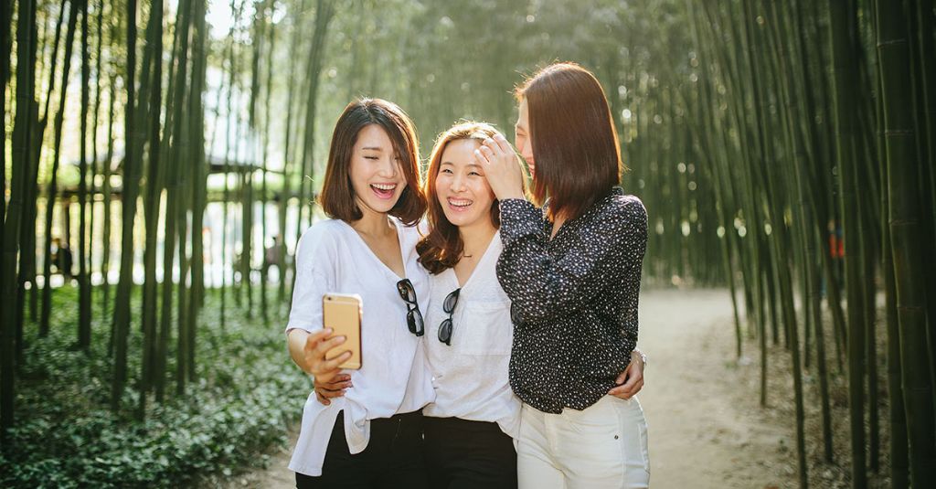 Three women taking a picture together.